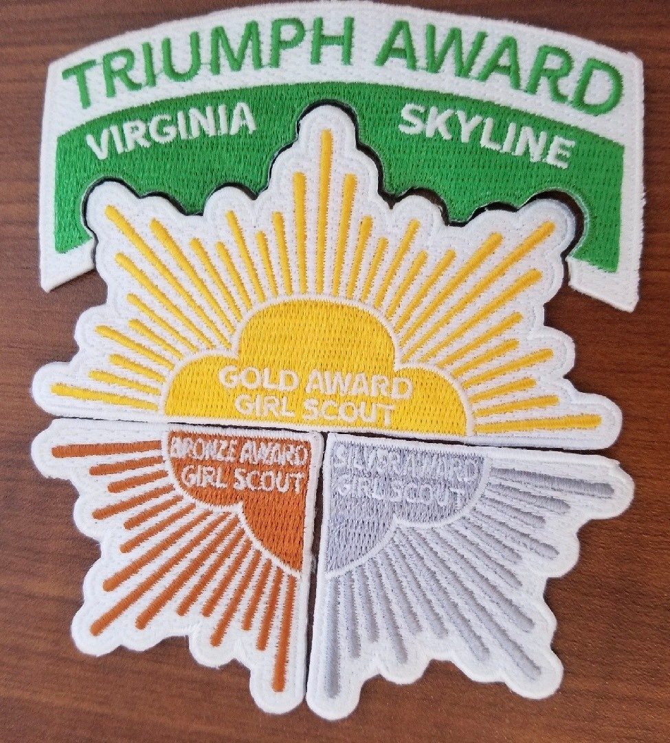 bronze, silver, gold and triumph patch put together 